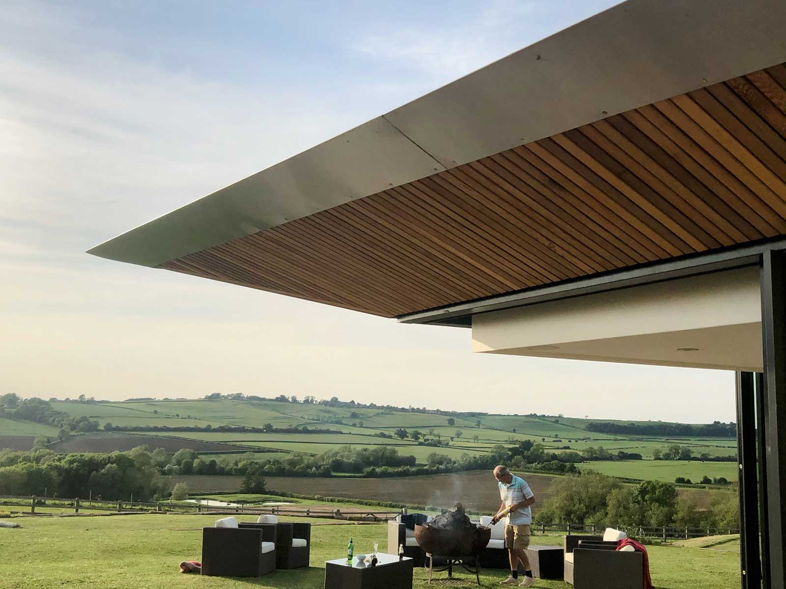 Glass and green roof farmhouse extension