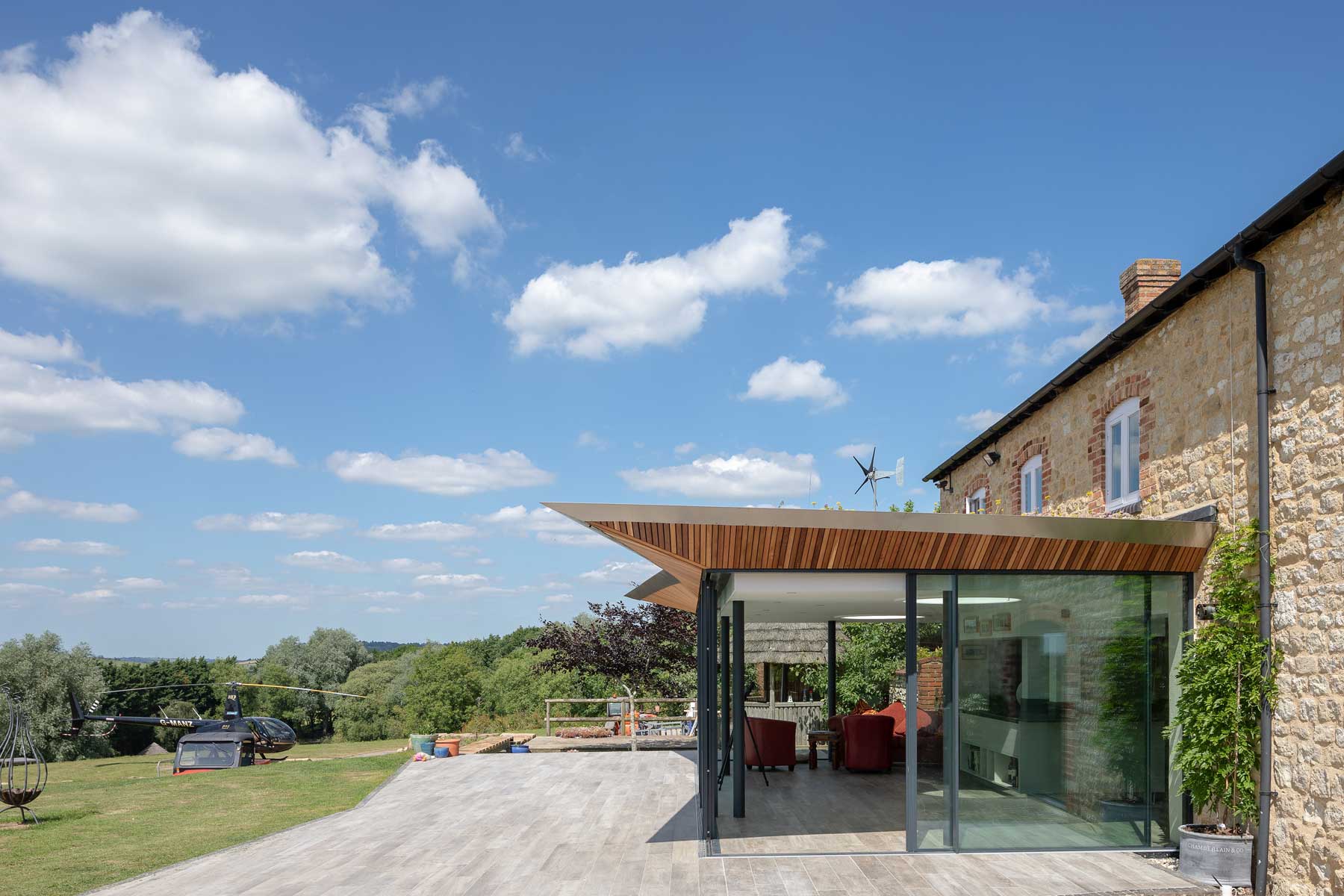 Glass and green roof farmhouse extension