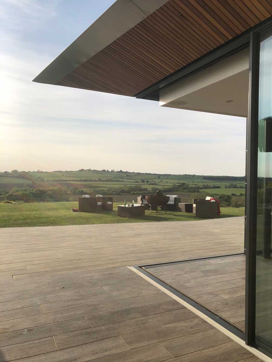 Glass and green roof farmhouse extension