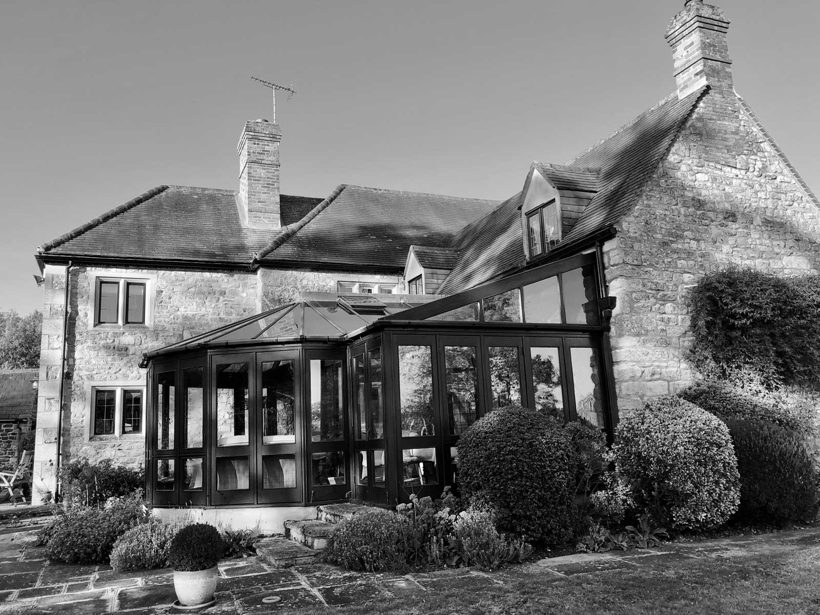 Glass and green roof extension to listed building before
